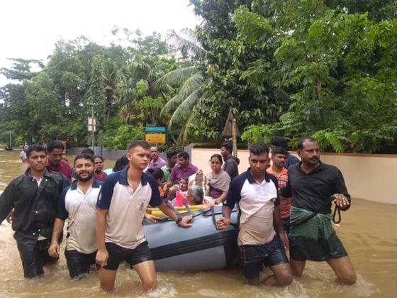 Indian Navy personnel with a Gemini boat seen rescuing flood-affected people in Kerala.